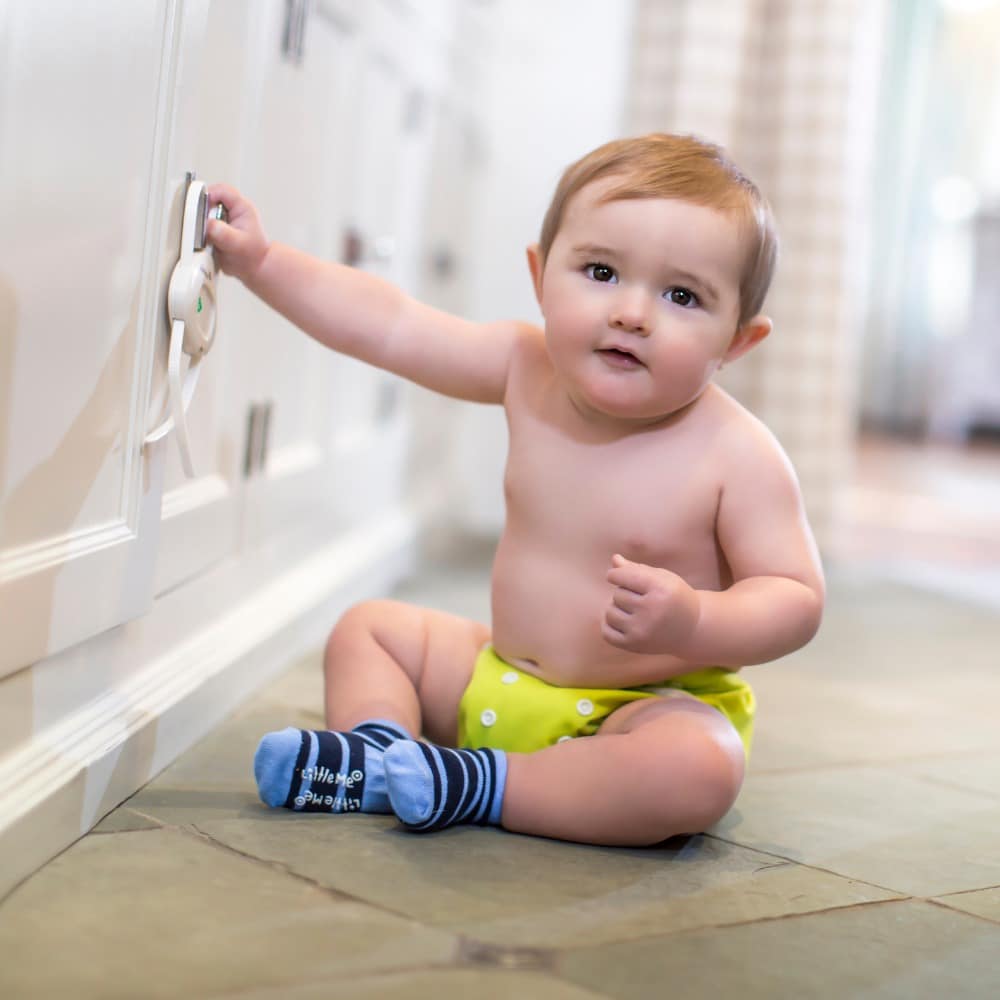 child at a kitchen cabinet