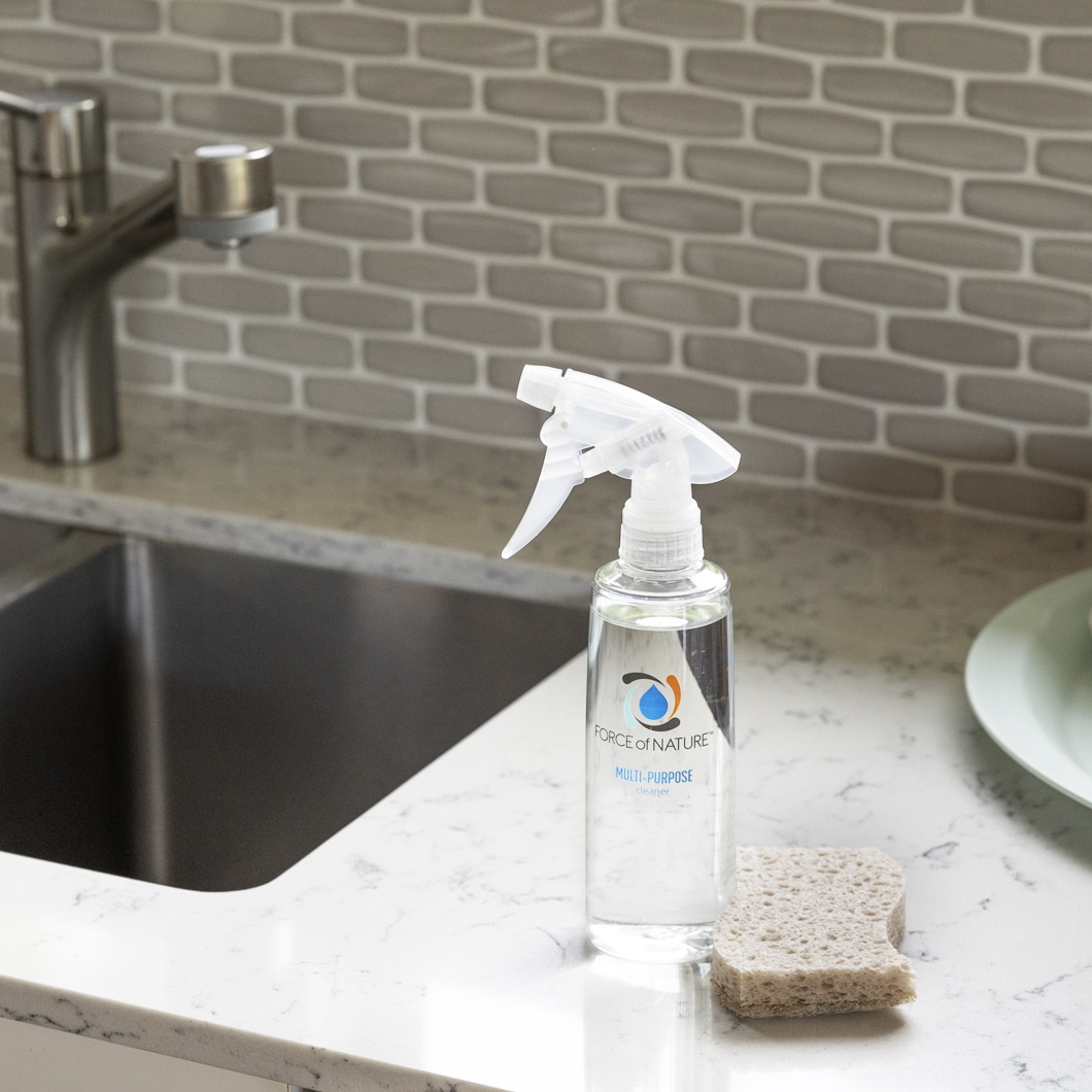 FON_Web_ProductImages_StarterKit_Img5 Force of Nature all-in-one cleaner, deodorizer & disinfectant on counter by sink