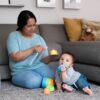 Force of Nature rinse-free disinfectant being sprayed on baby toys